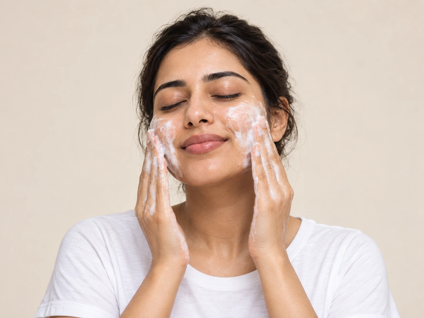 Woman gently cleansing her face