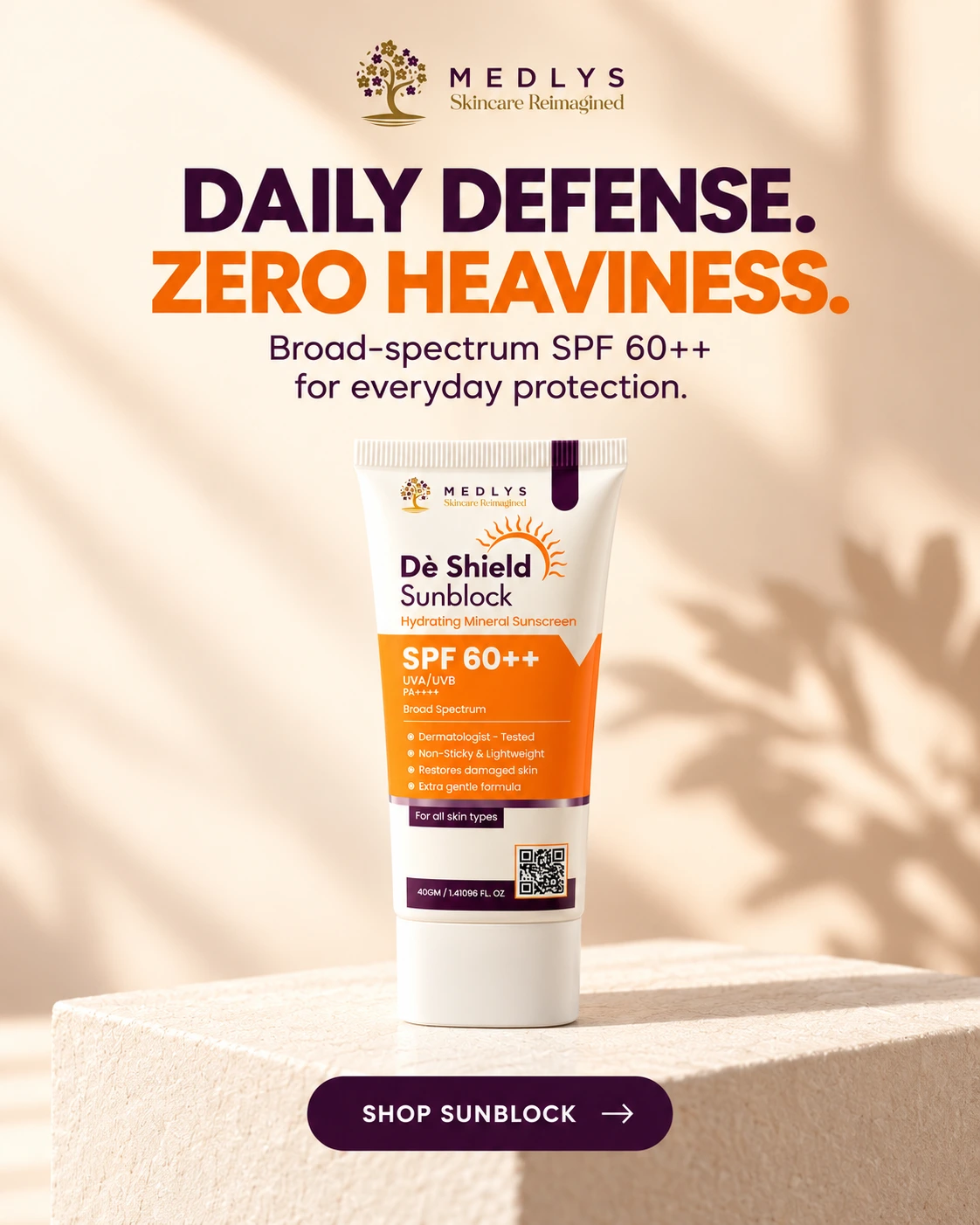 MEDLYS De Shield Sunblock SPF 60++ tube displayed on a beige background with soft sunlight and shadows, highlighting broad-spectrum UVA/UVB protection and a lightweight, non-sticky formula.